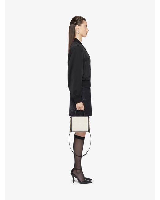 Minigonna a portafoglio Voyou in denim di Givenchy in Black