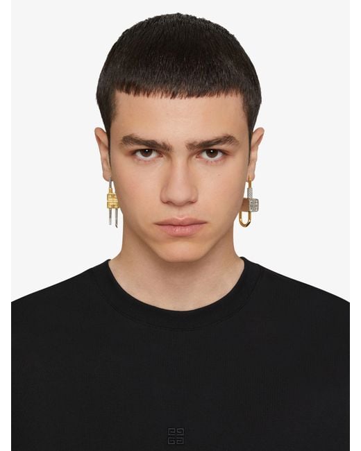 Givenchy White Lock Asymmetrical Earrings