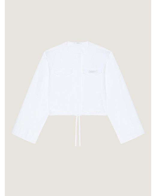 Camicia cropped in popeline con applicazione di Givenchy in White