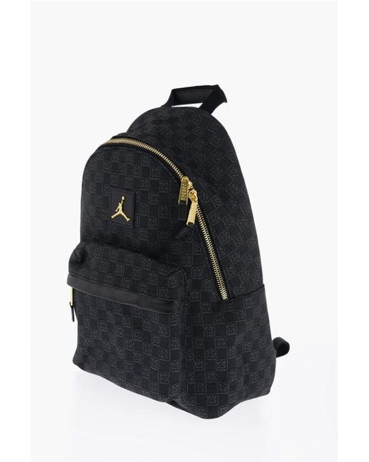 gold and black jordan backpack