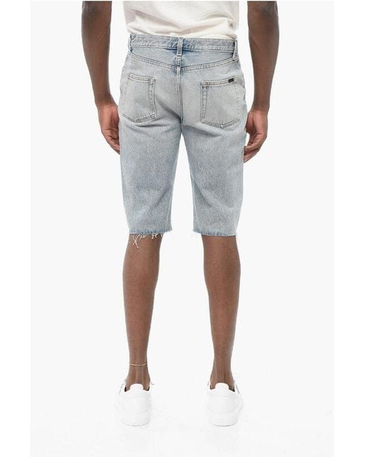 Saint Laurent Blue Light Wash Denim Shorts With Fringed Bottom for men
