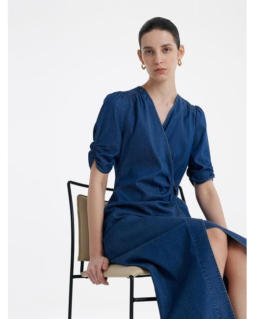 GOELIA Blue Denim V-Neck Twist Waist Midi Dress