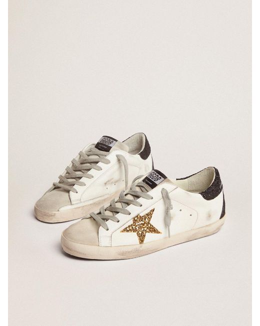 Zapatillas deportivas Super-Star con estrella dorada y refuerzo del talón  negro de purpurina Golden Goose de Cuero de color Metálico | Lyst