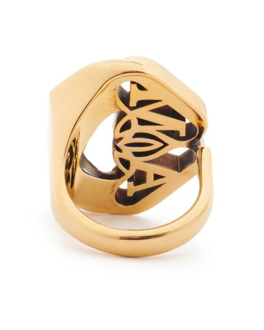 Anello con logo seal in oro di Alexander McQueen in Metallic