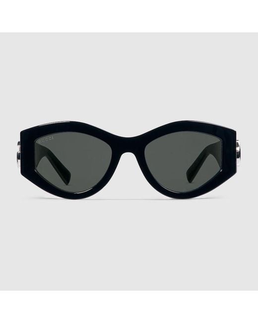 Lunettes De Soleil Ovales Gucci en coloris Black