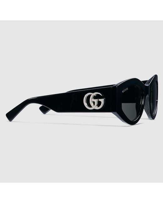 Lunettes De Soleil Ovales Gucci en coloris Black