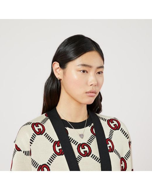 Orecchini trademark a forma di cuore di Gucci in Metallic