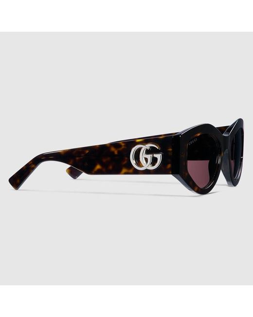 Lunettes De Soleil Ovales Gucci en coloris Brown