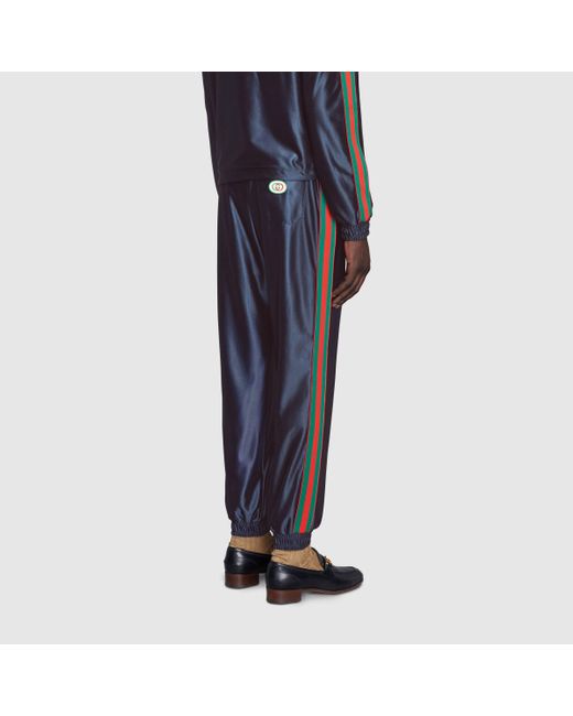 メンズ Gucci 公式 グッチ ウェブ ストライプ付き シャイニージャージー パンツブルーブルー ブルー Lyst
