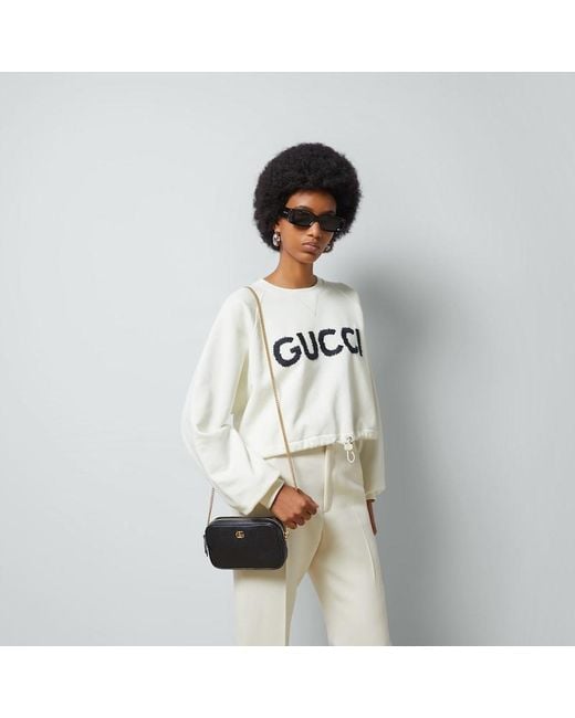 GG Marmont Mini Shoulder Bag di Gucci in Black