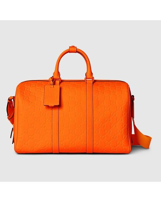 Gucci Orange GG Rubber-effect Medium Duffle Bag for men