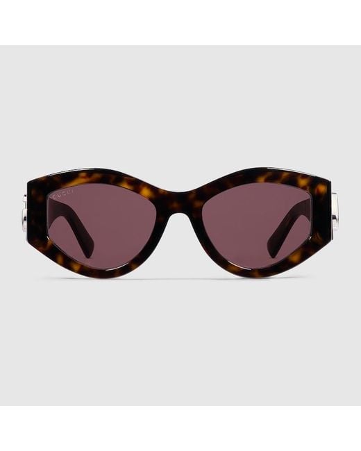 Lunettes De Soleil Ovales Gucci en coloris Brown
