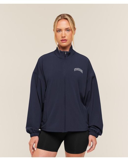 GYMSHARK Blue College Crest Graphic Track Jacket