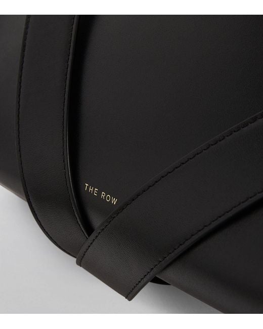 The Row Leather Isla Clutch Bag in Black | Lyst