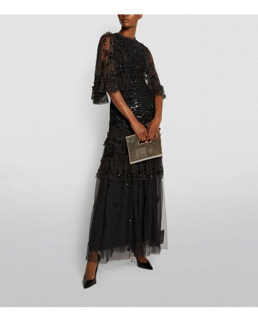 needle and thread black and white gown