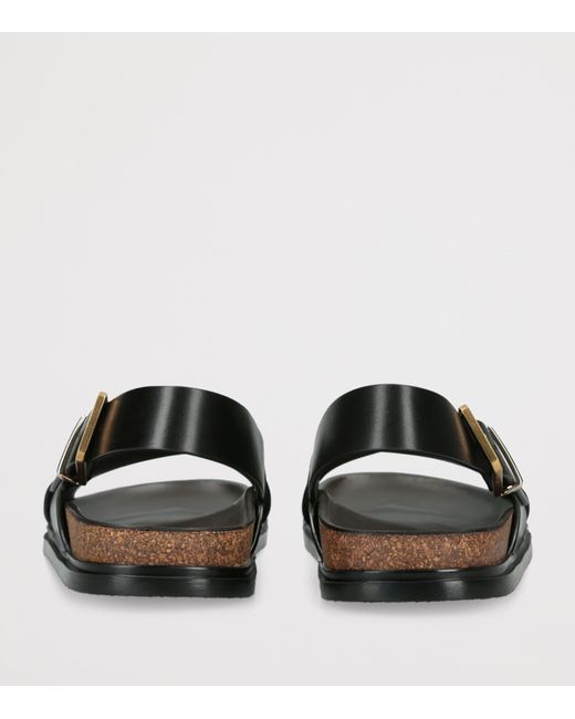 The Row Black Leather Buckle Sandals