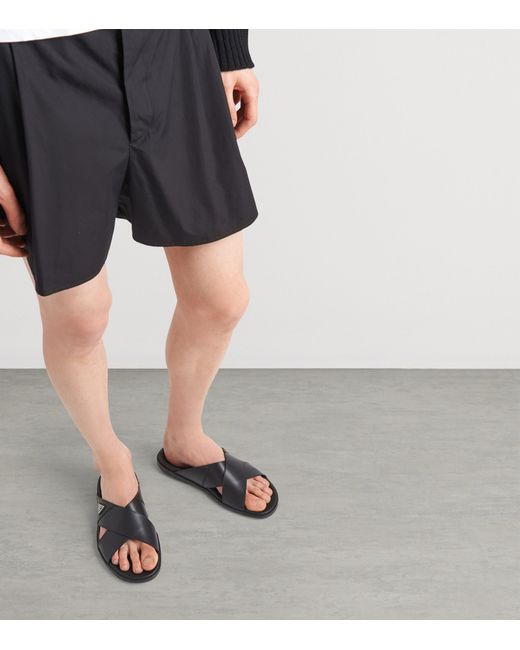 Prada Black Leather Crisscross Logo Slides for men