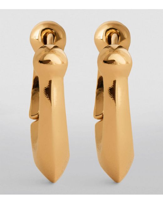 COACH Metallic Brass Signature C Huggie Earrings