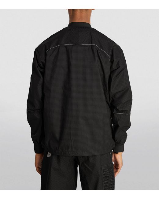 And Wander Black Technical Reflective Anorak for men