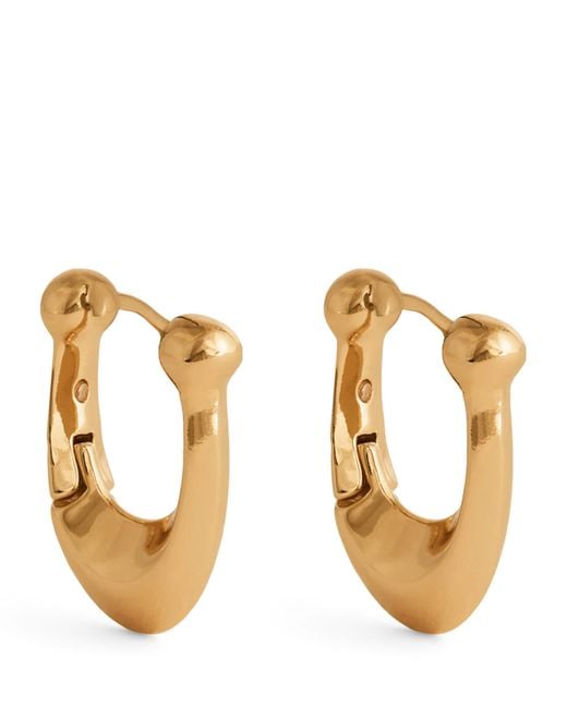COACH Metallic Brass Signature C Huggie Earrings
