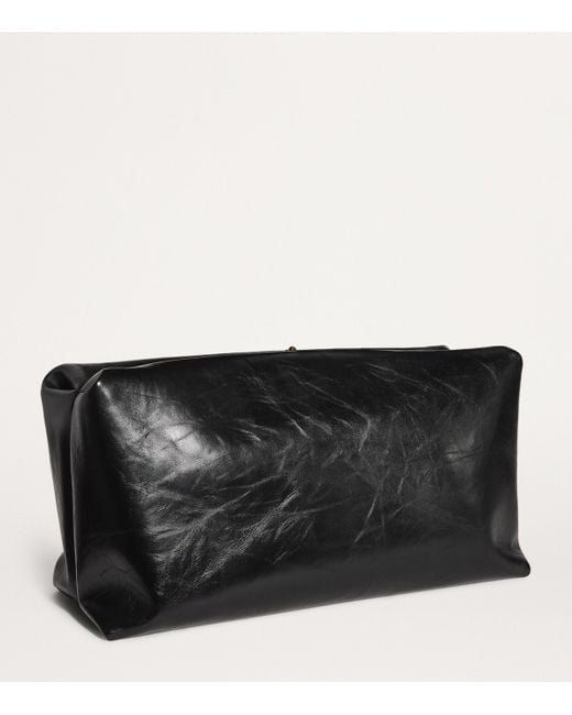 【関税&送料込み】Jil Sander Large 'Goji Pillow' Black Lea Jil Sander Large Leather Goji Pillow Clutch Bag in Black | Lyst