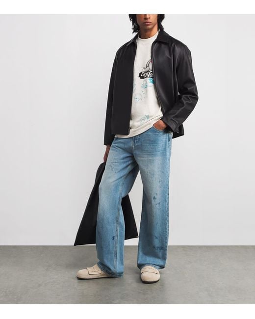 DOMREBEL Blue Scuffed Bootcut Jeans for men