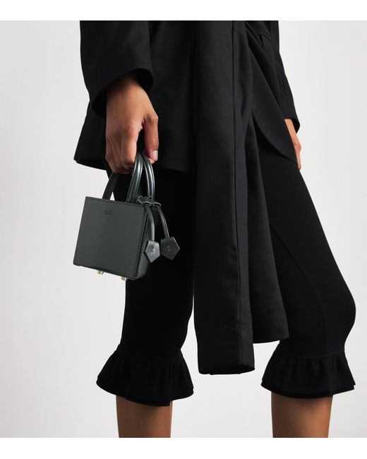 TALEL PARIS Black Leather Triangle Top-Handle Bag