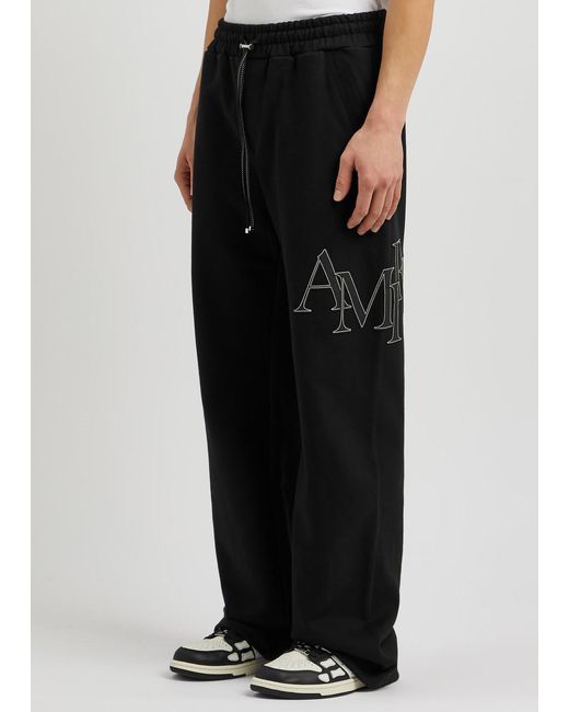 Amiri Black Logo-appliquéd Cotton Sweatpants for men