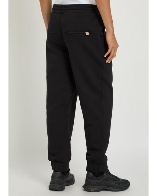 Now You Live Black Magna Logo-Embroidered Cotton-Blend Sweatpants for men