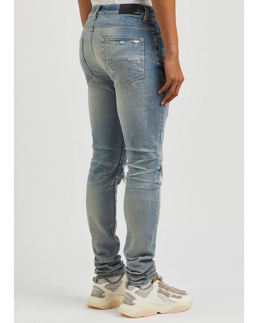 Amiri Blue Mx1 Distressed Skinny Jeans for men
