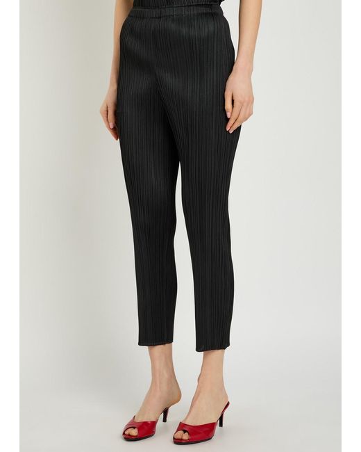 Pleats Please Issey Miyake Black Pleated Tapered-Leg Woven Trousers