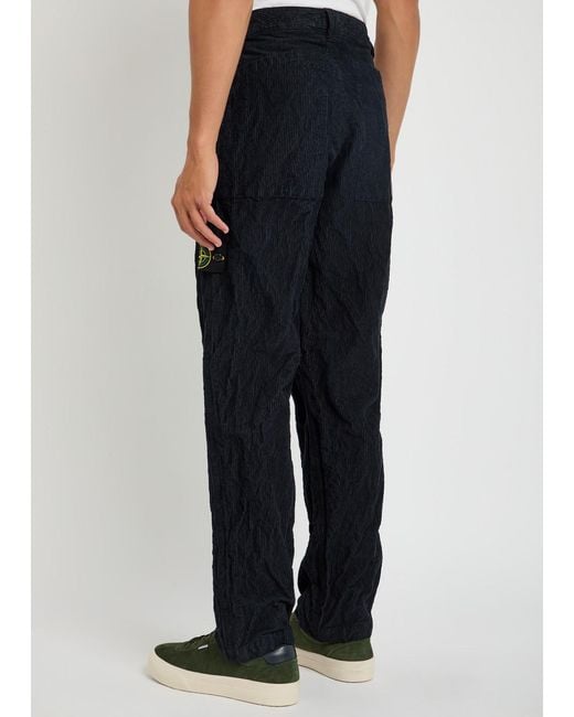 Stone Island Blue Logo Crinkled Tapered-Leg Corduroy Trousers for men