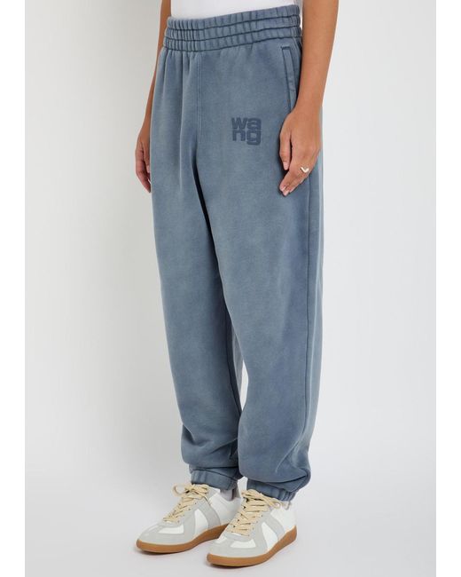 T By Alexander Wang Blue Logo-Embossed Cotton-Blend Sweatpants