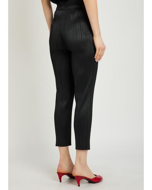 Pleats Please Issey Miyake Black Pleated Tapered-Leg Woven Trousers