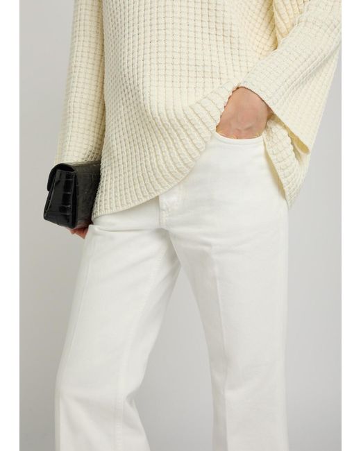 Totême White Kick Flared-Leg Denim Jeans