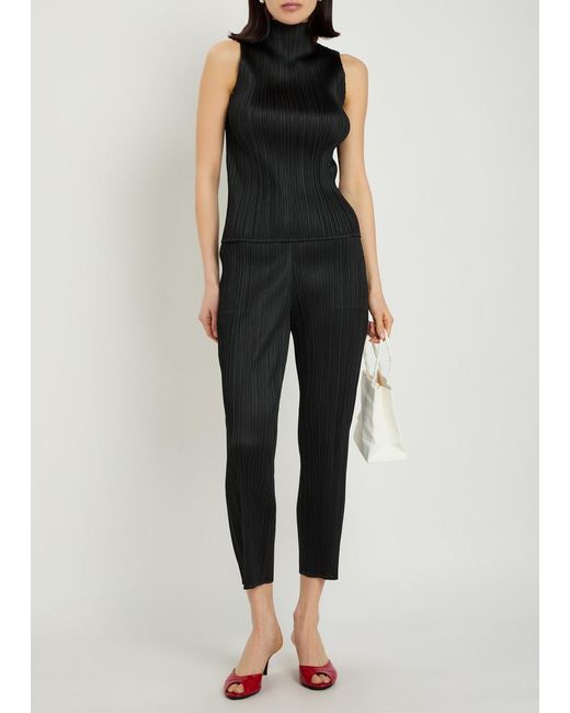 Pleats Please Issey Miyake Black Pleated Tapered-Leg Woven Trousers