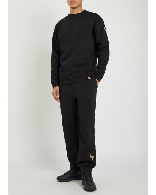 Now You Live Black Magna Logo-Embroidered Cotton-Blend Sweatpants for men