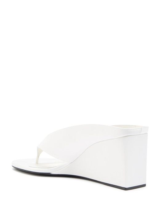 Alaïa Tong 75 Satin Wedge-Heeled Mules in White | Lyst