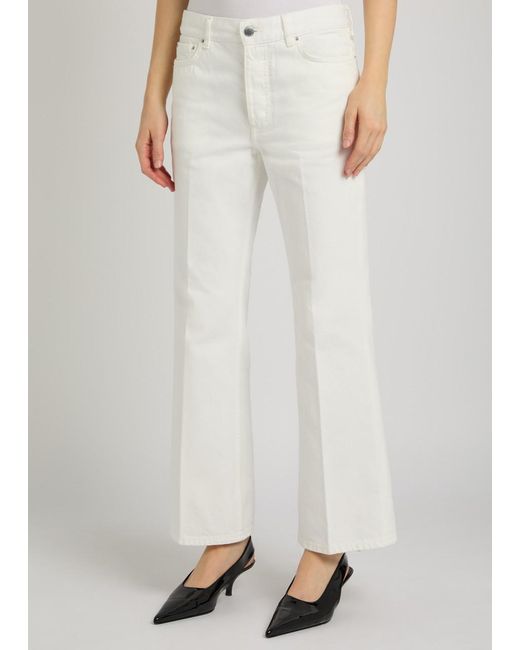 Totême White Kick Flared-Leg Denim Jeans