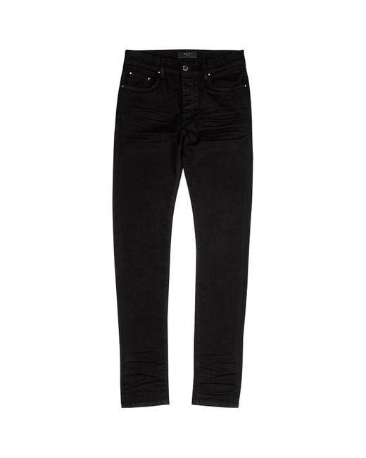 Amiri Black Stack Distressed Skinny Jeans for men