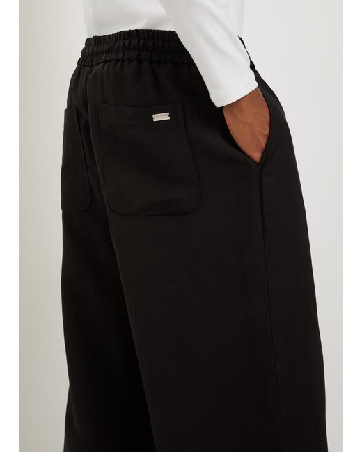AMI Black Wide-Leg Woven Trousers for men
