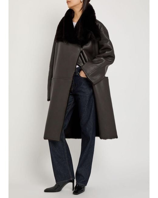 Totême  Black Panelled Shearling Wrap Coat