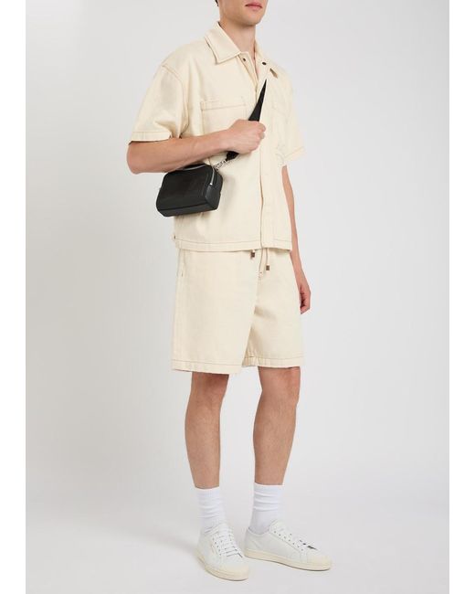 Amiri Natural Logo-Embossed Distressed Denim Shorts for men