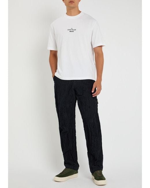 Stone Island Blue Logo Crinkled Tapered-Leg Corduroy Trousers for men
