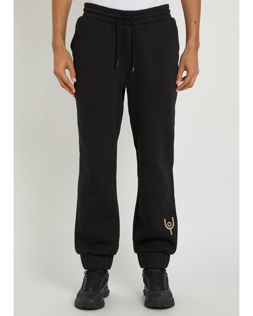 Now You Live Black Magna Logo-Embroidered Cotton-Blend Sweatpants for men