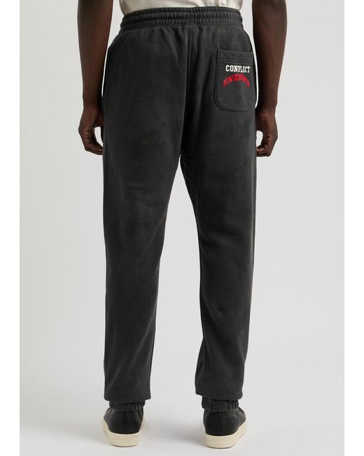 SAINT Mxxxxxx Denim Tears Struggle Printed Cotton Sweatpants in