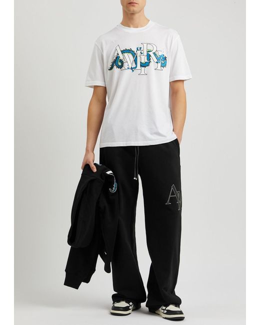 Amiri Black Logo-appliquéd Cotton Sweatpants for men