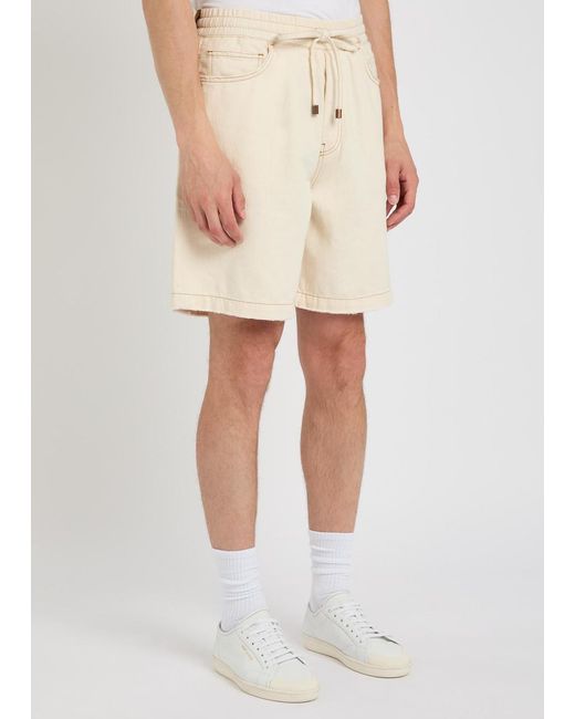 Amiri Natural Logo-Embossed Distressed Denim Shorts for men