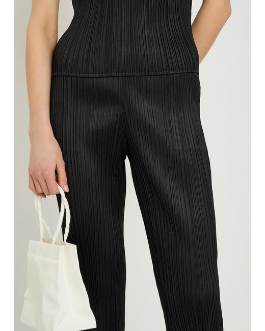 Pleats Please Issey Miyake Black Pleated Tapered-Leg Woven Trousers