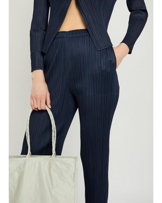 Pleats Please Issey Miyake Blue Pleated Tapered-Leg Woven Trousers